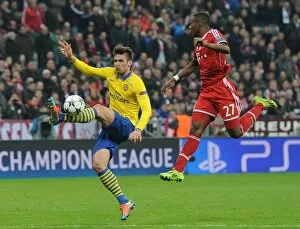 Images Dated 11th March 2014: Clash of Titans: Olivier Giroud vs. David Alaba - FC Bayern Munich vs