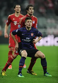 Bayern Munich V Arsenal 2012-13 Prints: Clash of Titans: Olivier Giroud vs Javi Martinez - Bayern Munich vs Arsenal