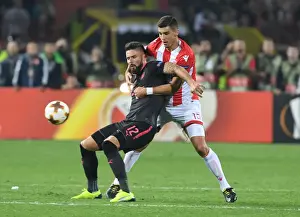 Red Star Belgrade V Arsenal 2017-18 Prints: Clash of Titans: Olivier Giroud vs Srdan Babic - Europa League Showdown: Arsenal FC vs Crvena Zvezda (2017-18)