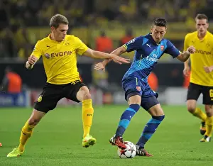 Borussia Dortmund V Arsenal 2014-15 Prints: Clash of Titans: Ozil vs. Ginter - Borussia Dortmund vs. Arsenal, UEFA Champions League