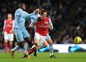 Images Dated 18th December 2011: Clash of Titans: Ramsey, Toure, and Barry - Premier League Showdown: Manchester City vs