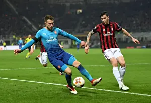 AC Milan V Arsenal 2017-18 Prints: Clash of Titans: Ramsey vs. Romagnoli in the Europa League Showdown - AC Milan vs. Arsenal