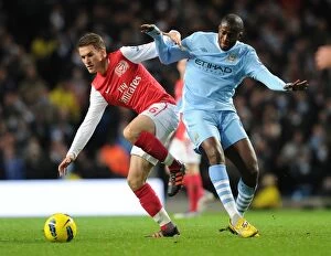 Images Dated 18th December 2011: Clash of Titans: Ramsey vs. Yaya Toure - Manchester City vs. Arsenal, Premier League, 2011