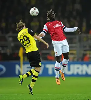 Borussia Dortmund V Arsenal 2013-14 Prints: Clash of Titans: Sagna vs. Schmelzer - Borussia Dortmund vs