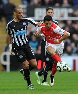 Newcastle United V Arseal 2014/15 Prints: Clash of Titans: Sanchez vs. Gouffran at St