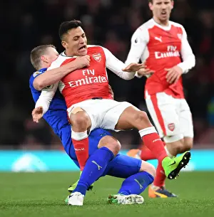 Arsenal V Leicester City 2016-17 Prints: Clash of Titans: Sanchez vs. Huth in Arsenal's Battle Against Leicester City
