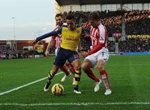 Stoke City V Arsenal 2014-15 Prints: Clash of Titans: Sanchez vs Pieters-Muniesa at Stoke City vs Arsenal (2014-15)