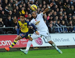 Swansea V Arsenal 2014-15 Prints: Clash of Titans: Sanchez vs. Williams in Swansea Derby