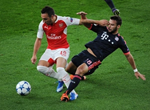 Arsenal V Bayern Munich 2015/16 Prints: Clash of Titans: Santi Cazorla vs