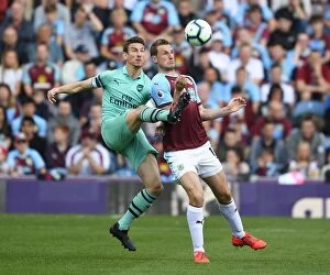 Images Dated 12th May 2019: Clash at Turf Moor: Koscielny vs. Wood in Burnley vs. Arsenal Premier League Showdown
