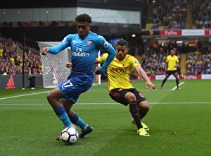 Watford V Arsenal 2017-18 Prints: Clash at Vicarage Road: Iwobi vs Mariappa in Premier League Showdown