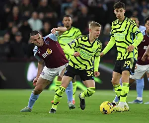 Clash at Villa Park: Arsenal's Zinchenko Faces Off Against McGinn