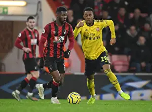 Clash at Vitality: Arsenal's Willock Tackles Bournemouth's Lerma in Premier League Showdown
