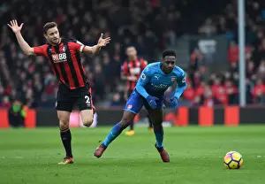 AFC Bournemouth V Arsenal 2017-18 Prints: Clash at Vitality: Welbeck and Francis Lock Horns in AFC Bournemouth vs Arsenal Showdown