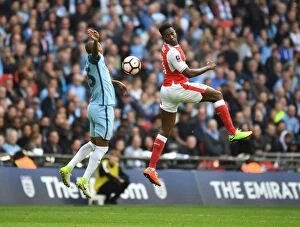 Arsenal v Manchester City - FA Cup 1/2 Final 2017 Collection: Clash at Wembley: Welbeck Leaps Over Fernandinho in FA Cup Semi-Final Showdown