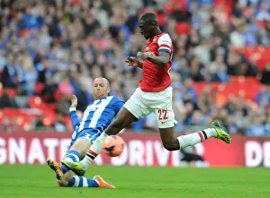 Arsenal V Wigan Athletic - FA Cup Semi Final 2014 Prints: Clash at Wembley: Yaya Sanogo vs. Stephen Crainey - FA Cup Semi-Final Showdown