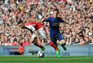 Images Dated 7th May 2017: Clash of the Wingers: Gibbs vs. Herrera - Arsenal vs Manchester United (2016-17)