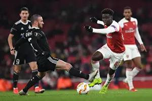 Arsenal V Qarabag 2018-19 Prints: Clash of Wings: Bukayo Saka vs Gara Gareyev in Arsenal's Europa League Battle