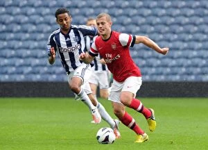 Images Dated 1st October 2012: Clash of the Young Stars: Jack Wilshere vs Mani O'Sullivan in Arsenal's U21 Triumph over West