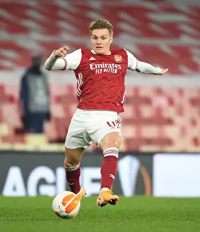 Behind Closed Doors: Martin Odegaard in Europa League Action for Arsenal Against Olympiacos