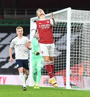 Behind Closed Doors: Martin Odegaard's Premier League Showdown with Manchester City, 2021
