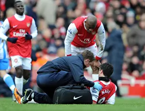 Colin Lewin and Abou Diaby check on the injured Samir Nasri (Arsenal). Arsenal 2