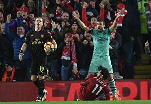 Images Dated 29th December 2018: Controversial Penalty Call: Sokratis and Leno Protest as Mo Salah Scores for Liverpool Against