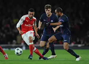 Arsenal V Paris Saint-Germain 2016-17 Prints: Coquelin Under Fire: Arsenal's Midfielder Battles Meunier and Moura in Intense Arsenal vs