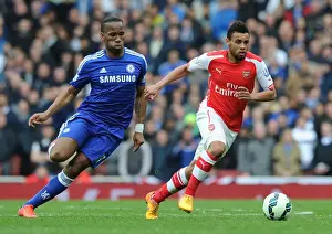 Arsenal V Chelsea 2014/15 Prints: Coquelin Outsmarts Drogba: Arsenal's Thrilling Victory Over Chelsea (2014/15)