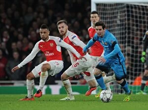 Arsenal v Barcelona 2015/16 Collection: Coquelin and Ramsey's Defiant Stand: Messi Halted in Arsenal's Champions League Battle vs. Barcelona