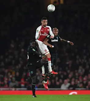 Arsenal V West Ham United - Carabao Cup 2017-18 Prints: Coquelin vs. Ayew and Quina: A Headed Battle in the Carabao Cup Clash between Arsenal and West Ham