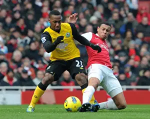 Arsenal V Blackburn Rovers 2011-12 Prints: Coquelin vs. Hoilett: A Premier League Tackle Battle at Emirates Stadium