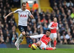 Tottenham Hotspur v Arsenal 2014-15 Collection: Coquelin vs. Kane: Intense Battle in Tottenham vs. Arsenal Premier League Clash