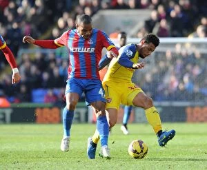Images Dated 21st February 2015: Coquelin vs. Puncheon: Intense Battle in Crystal Palace vs. Arsenal Premier League Clash