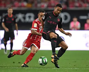 Coquelin vs Rafinha: A Football Battle in Shanghai - Arsenal vs Bayern Munich Pre-Season Clash (2017)