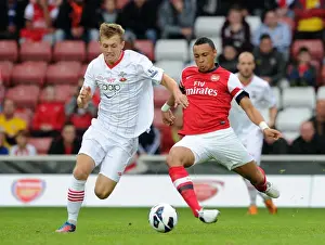 Southampton V Arsenal 2012-13 - Pre Season Prints: Coquelin vs Ward-Prowse: Battle in the Pre-Season Friendly between Southampton and Arsenal