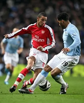 Manchester City v Arsenal - Carling Cup 2009-10 Collection: Craig Eastmond (Arsenal) Jolen Lescott (Man City). Manchester City 3: 0 Arsenal
