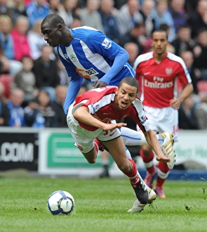 Images Dated 18th April 2010: Craig Eastmond (Arsenal) Mohamed Diame (Wigan). Wigan Athletic 3: 2 Arsenal