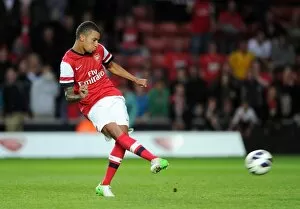 Craig Eastmond scores for Arsenal from the penalty spot during the shoot out