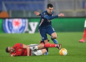 Dani Ceballos Breaks Past Adel Taarabt: Arsenal vs. SL Benfica - UEFA Europa League Round of 32, Rome, Italy