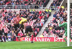 Danny Collins (Sunderland) heads into his own goal under pressure from Abu Diaby for the 1st Arsenal