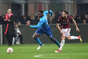 AC Milan V Arsenal 2017-18 Prints: Danny Welbeck (Arsenal) Hakan Calhanoglu (AC Milan)