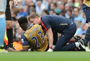 Manchester City V Arsenal 2105-16 Prints: Danny Welbeck (Arsenal) is treated by Physio Colin Lewin. Manchester City 2: 2 Arsenal