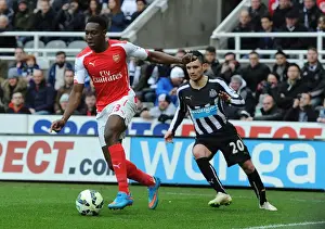 Newcastle United V Arseal 2014/15 Prints: Danny Welbeck Breaks Past Newcastle's Remy Cabella: Arsenal vs Newcastle United