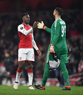 Images Dated 15th March 2018: Danny Welbeck and Gianluigi Donnarumma Share a Moment after Arsenal vs AC Milan Europa League Clash
