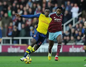 West Ham United V Arsenal 2014-15 Prints: Danny Welbeck vs. Alex Song: Battle in the Premier League - Arsenal vs