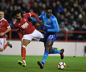 Nottingham Forest V Arsenal FA Cup 3rd Round 2017-18 Prints: Danny Welbeck vs Armand Traore: Clash in the FA Cup Third Round - Nottingham Forest vs Arsenal