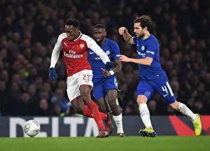 Chelsea v Arsenal - Carabao Cup 1/2 final 1st leg 2017-18 Collection: Danny Welbeck vs. Cesc Fabregas: Clash in the Carabao Cup Semi-Final