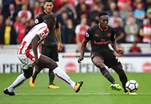 Stoke City V Arsenal 2017-18 Prints: Danny Welbeck vs Kurt Zouma: Intense Battle in Stoke City vs Arsenal Premier League Clash