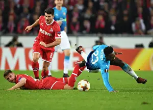 FC Koln V Arsenal 2017-18 Prints: Danny Welbeck vs. Milos Mere: A Battle in the UEFA Europa League between Arsenal and 1